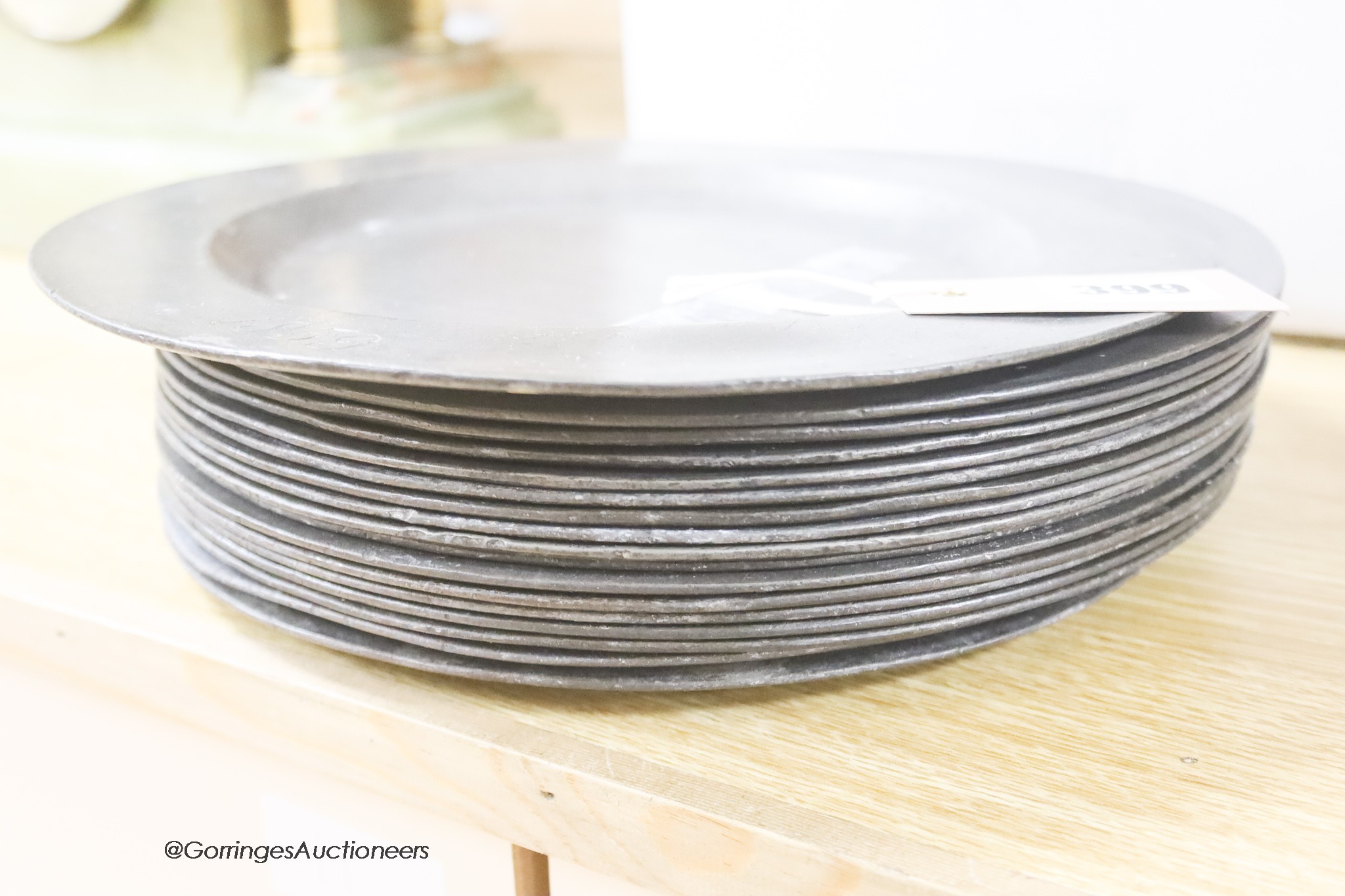 A set of eighteen 19th century pewter plates engraved with the Wentworth family crest, diameter 25cm